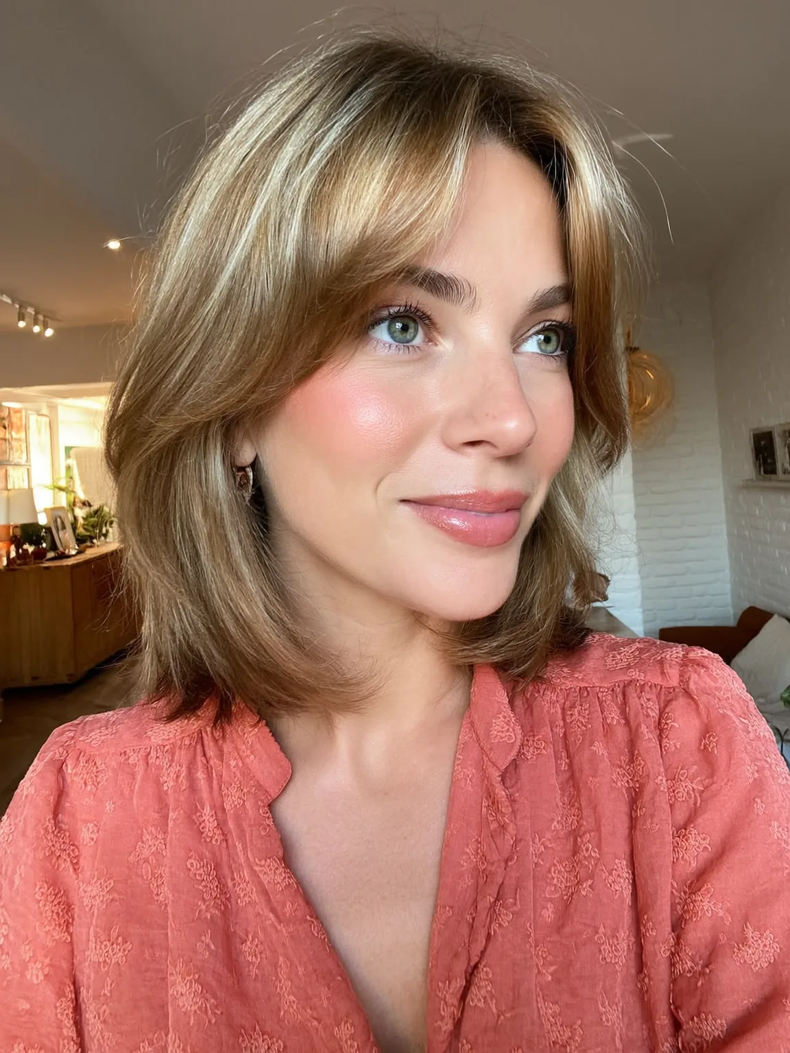caramel blonde with subtle highlights feathered layers